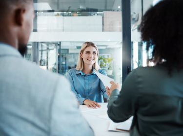 Recruitment, job interview or business people in meeting for hiring, feedback or documents review in office. Happy, smile or HR women with paper for contract sign, consulting or startup teamwork.